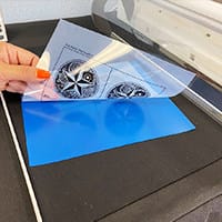 Exposing the printed out designs onto a film