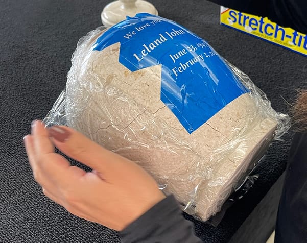 wrapping plastic all around the urn