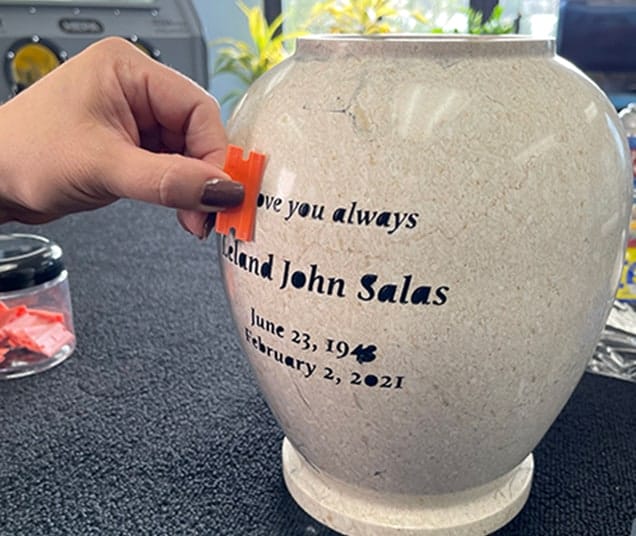 using razor on urn to remove excess paint