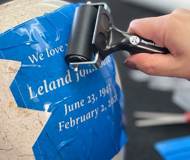 rolling rubber brayer over photomask