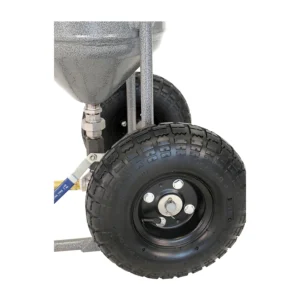 Close-up of a wheel system used in Rayzist photomask application equipment, 50lb pressure pot, showcasing durable tires and precision components for high-quality mask production.