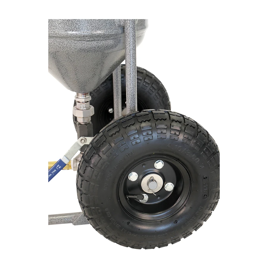 Close-up of a wheel system used in Rayzist photomask application equipment, 50lb pressure pot, showcasing durable tires and precision components for high-quality mask production.